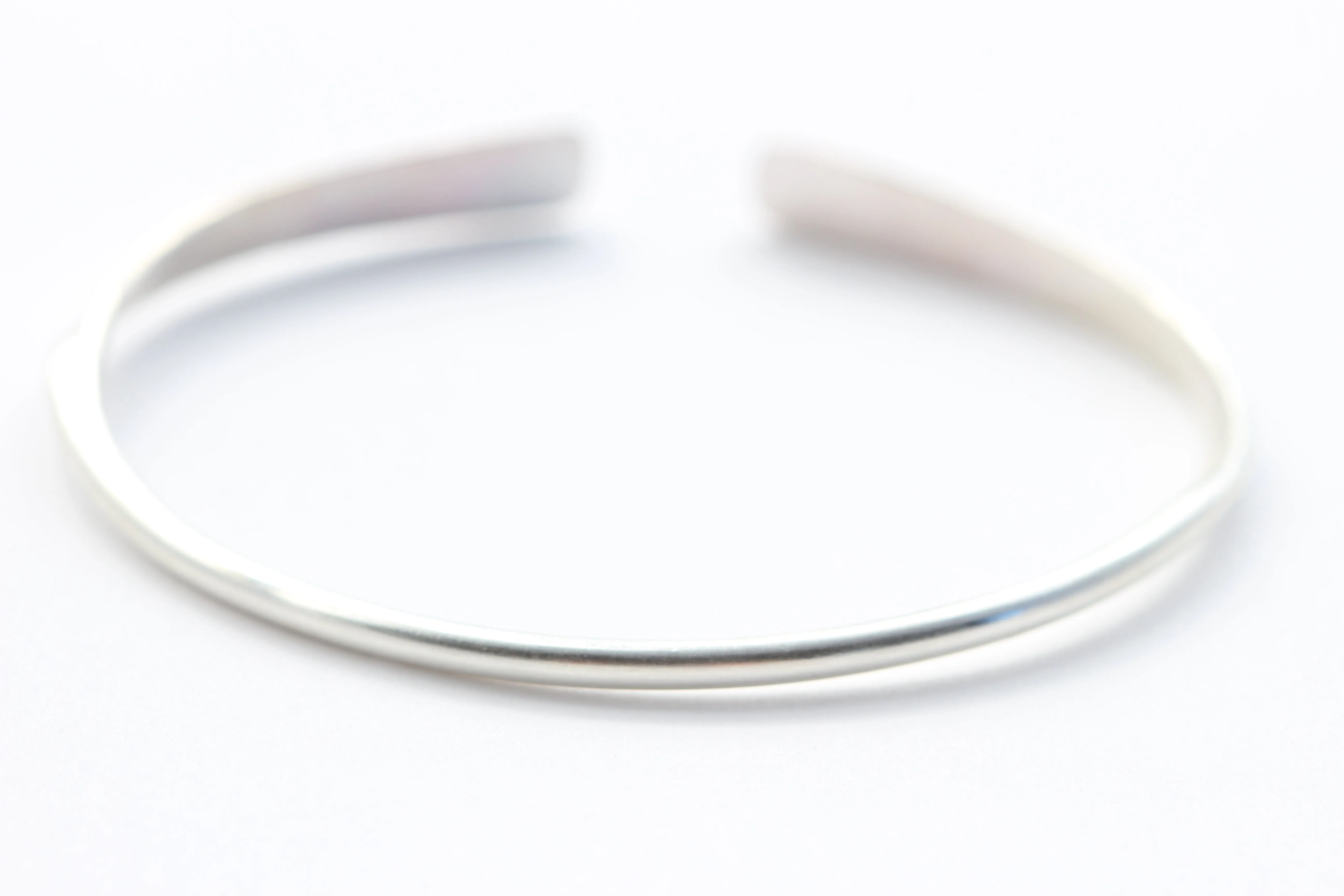 Slightly Twisted Sterling Silver and 14k Gold Bracelet