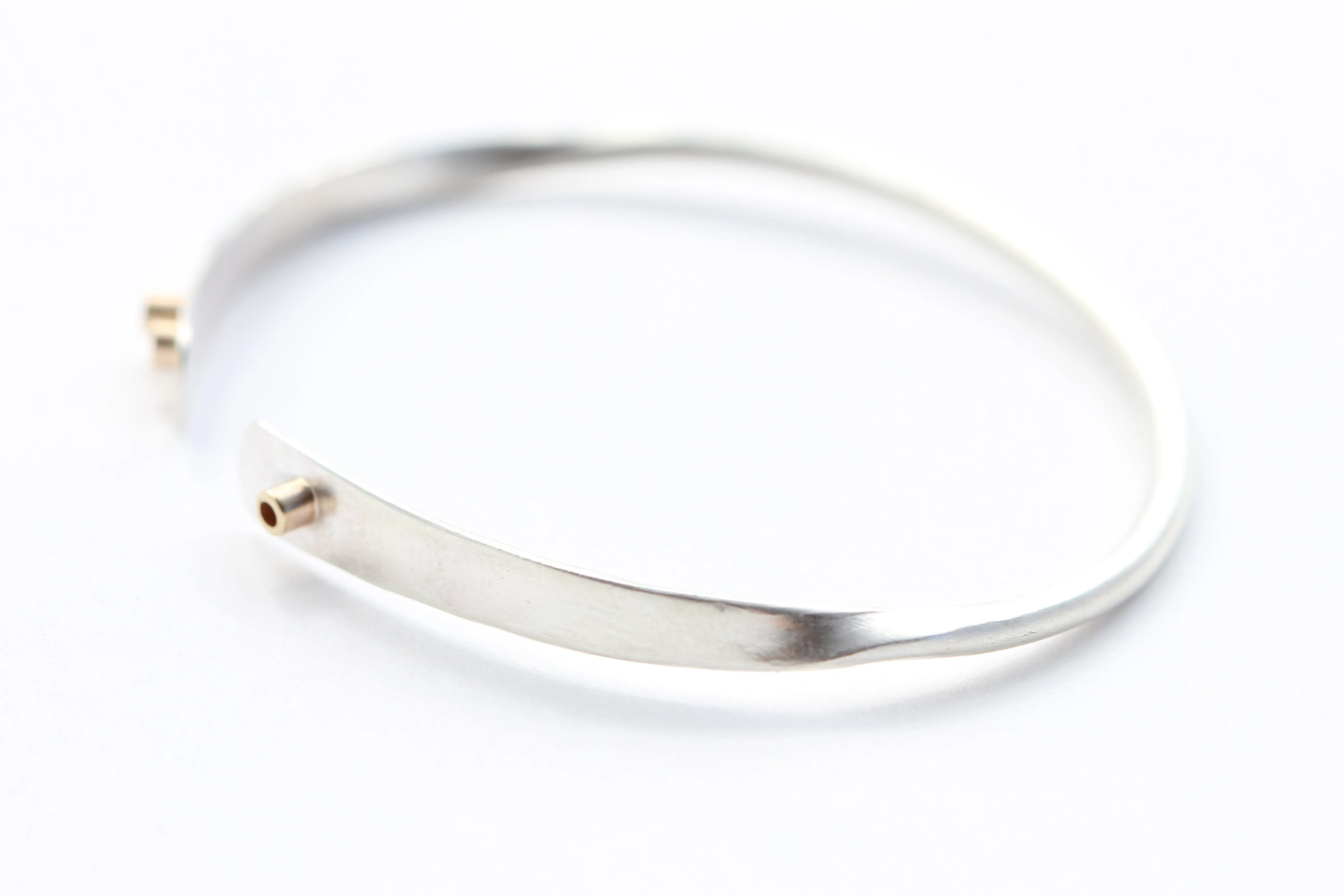 Slightly Twisted Sterling Silver and 14k Gold Bracelet